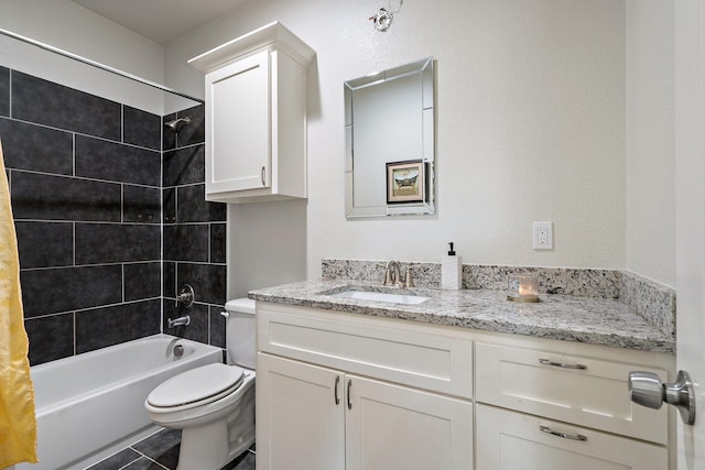 full bathroom with tiled shower / bath combo, vanity, tile patterned flooring, and toilet