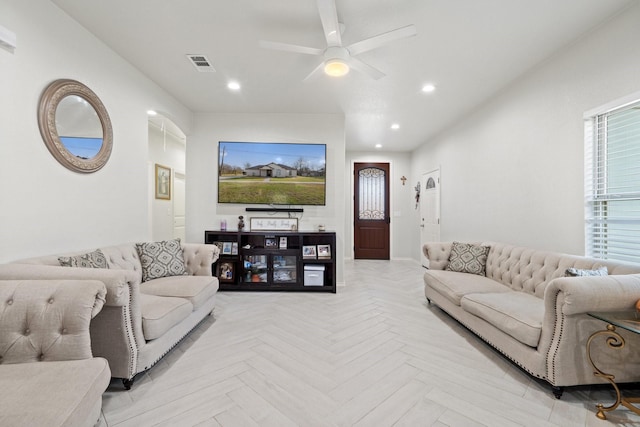 living room featuring ceiling fan and light parquet flooring