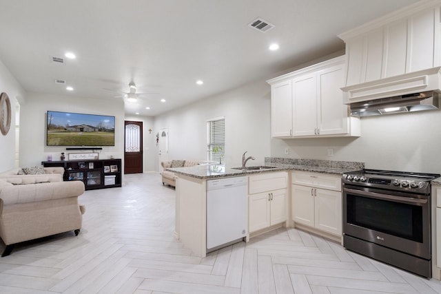 kitchen featuring light stone counters, stainless steel range with electric stovetop, white cabinetry, dishwasher, and kitchen peninsula