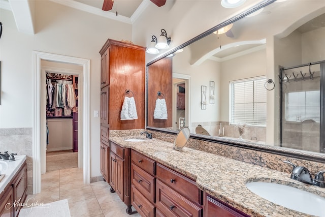 bathroom featuring a washtub, ceiling fan, tile patterned flooring, vanity, and ornamental molding