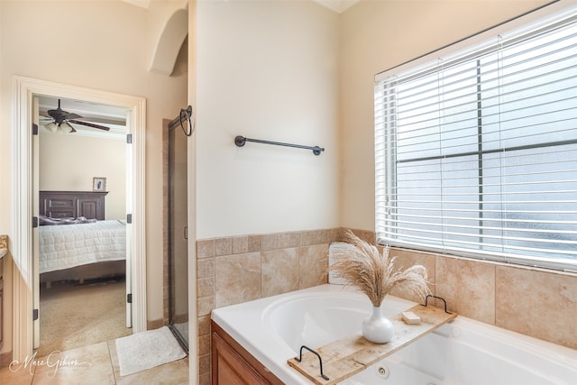 bathroom featuring a tub to relax in and a wealth of natural light