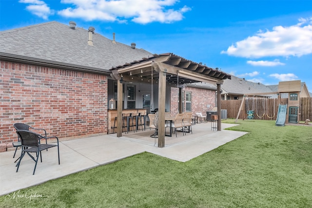 back of property featuring a yard, a patio, central AC unit, a playground, and a bar