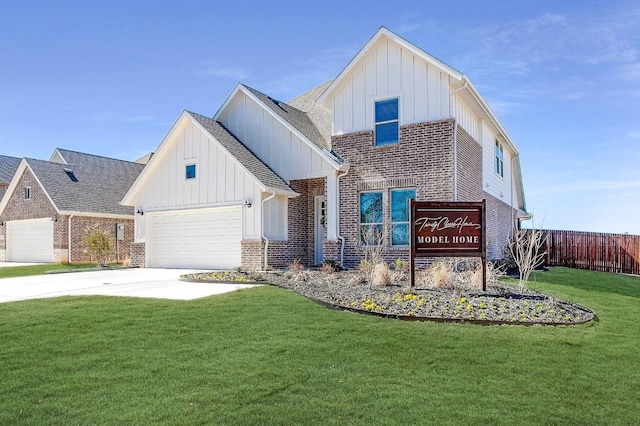 view of front of home featuring a garage and a front lawn