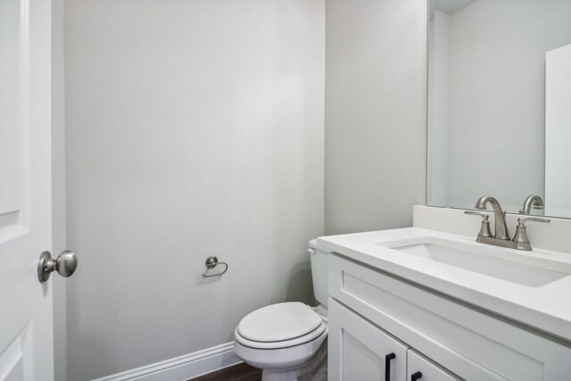 unfurnished bedroom featuring ceiling fan and dark hardwood / wood-style flooring