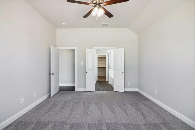 unfurnished room featuring lofted ceiling, carpet flooring, and ceiling fan