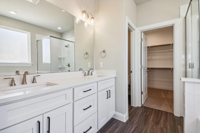 bathroom with hardwood / wood-style flooring, vanity, and independent shower and bath