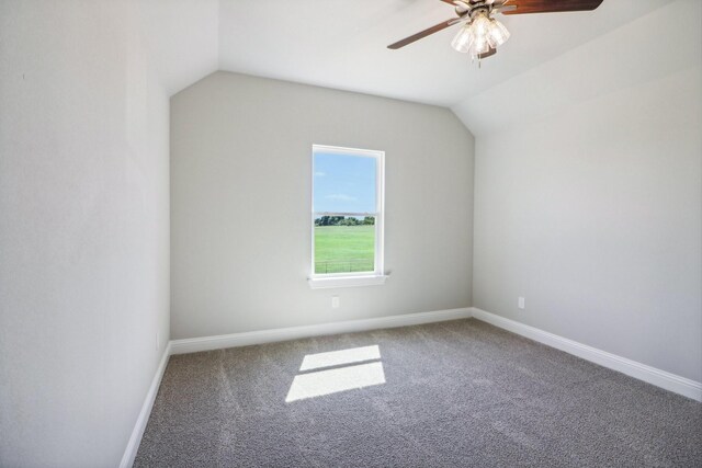 additional living space featuring vaulted ceiling, ceiling fan, and carpet