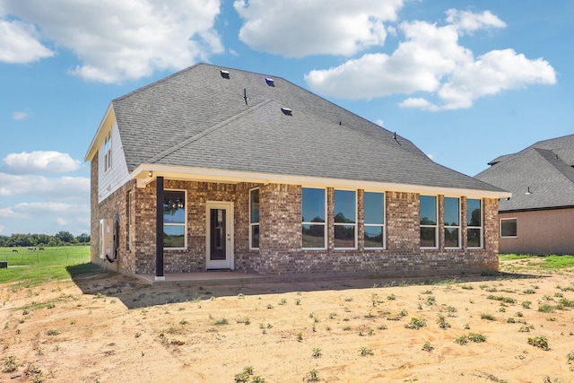 rear view of property featuring a patio area