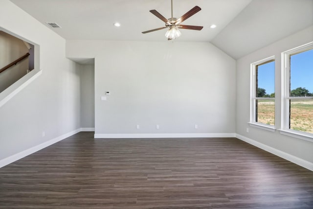 kitchen with white cabinetry, stainless steel appliances, a wealth of natural light, decorative light fixtures, and vaulted ceiling