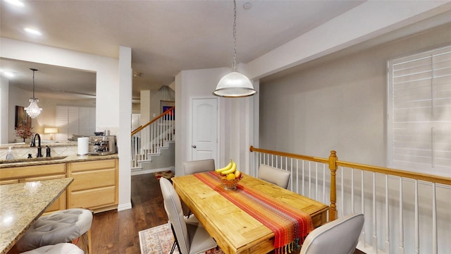 dining space featuring sink and dark hardwood / wood-style floors