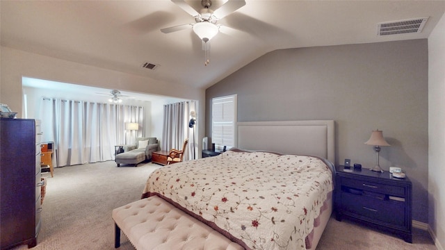 carpeted bedroom featuring lofted ceiling and ceiling fan