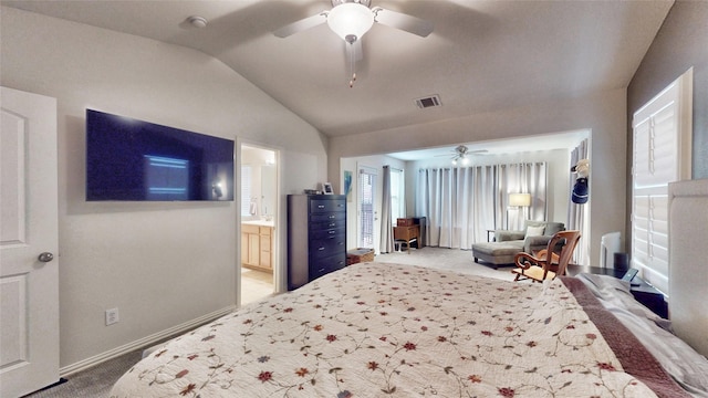 bedroom featuring lofted ceiling, carpet floors, connected bathroom, and ceiling fan