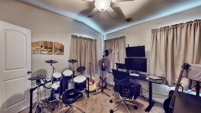 carpeted home office featuring ceiling fan and lofted ceiling