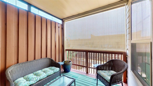 sunroom featuring a balcony