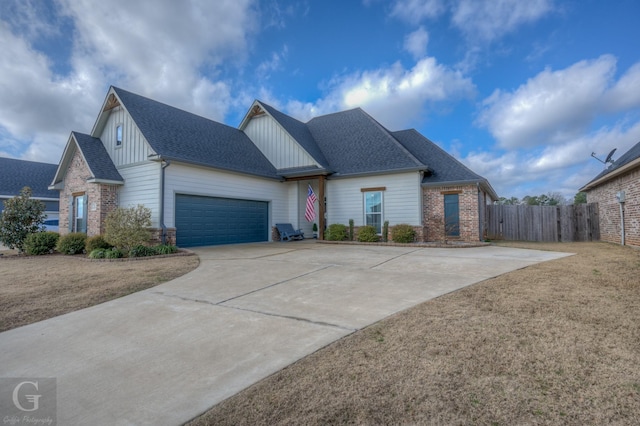 view of front of house with a garage and a front yard