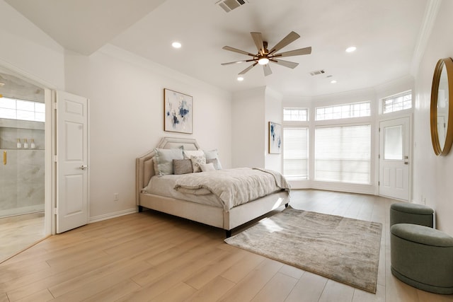 bedroom featuring crown molding, ceiling fan, and light hardwood / wood-style flooring