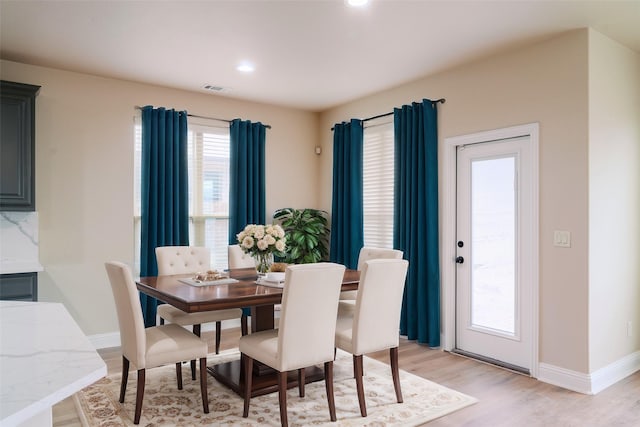 dining room with light hardwood / wood-style floors