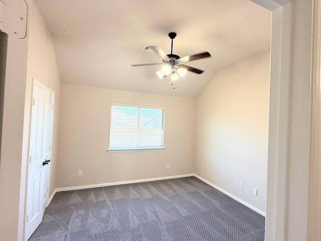 unfurnished room featuring ceiling fan, vaulted ceiling, and carpet