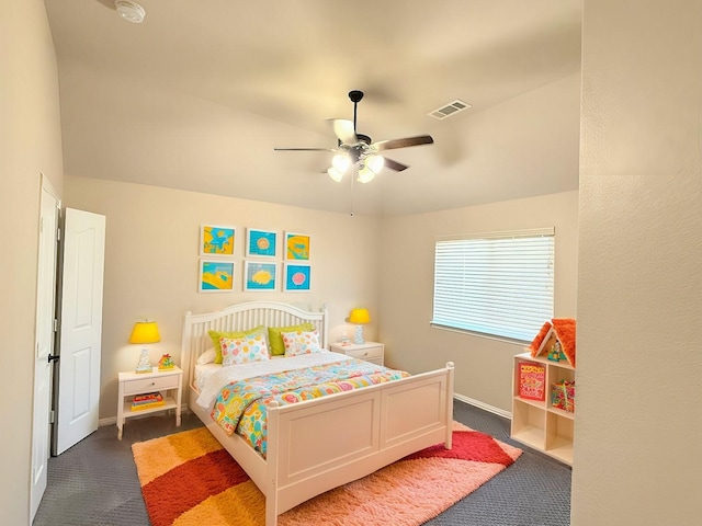 bedroom featuring dark carpet and ceiling fan