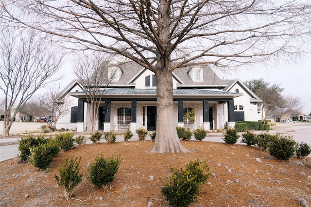 view of front of property featuring covered porch