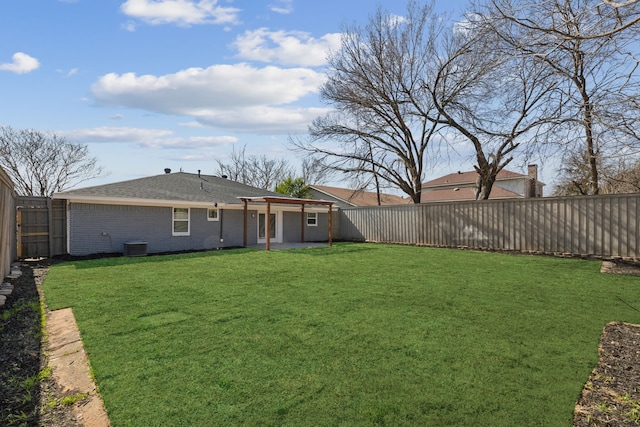 view of yard featuring central AC unit and a patio