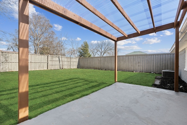 view of yard featuring central AC unit and a patio