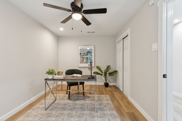 office space featuring hardwood / wood-style flooring and ceiling fan