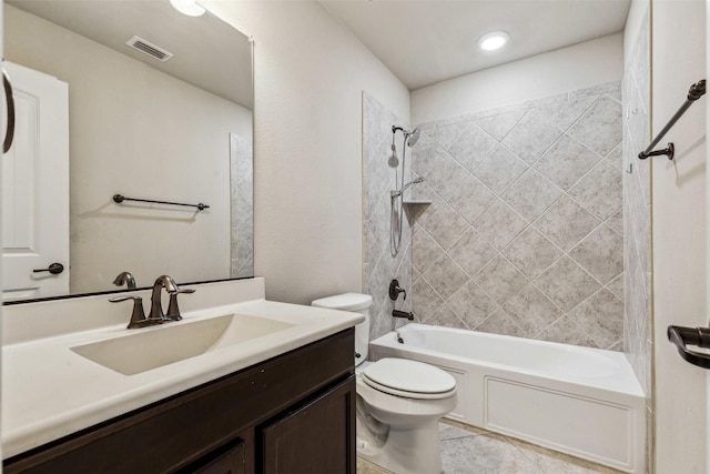 full bathroom with vanity, tiled shower / bath combo, and toilet