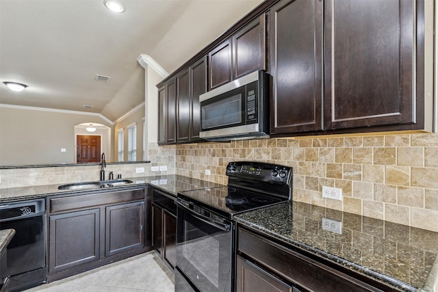 kitchen featuring sink, crown molding, light tile patterned floors, black appliances, and dark stone counters