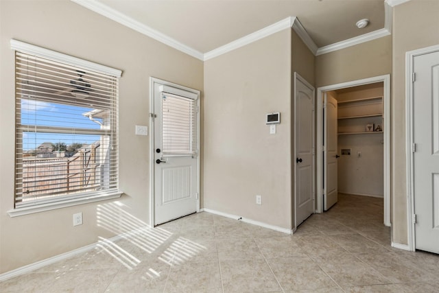 tiled entrance foyer with crown molding