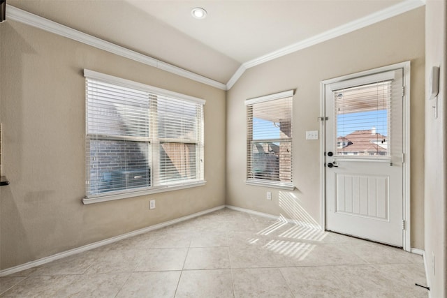 entryway with ornamental molding, vaulted ceiling, and light tile patterned floors