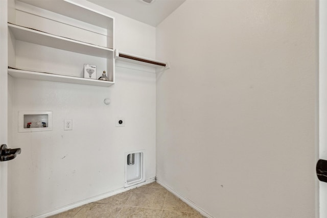 laundry area featuring gas dryer hookup, light tile patterned flooring, hookup for a washing machine, and electric dryer hookup