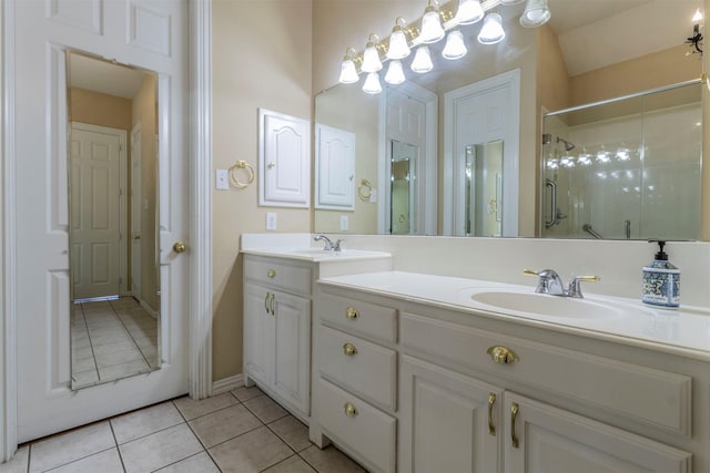 bathroom with tile patterned flooring, vanity, and an enclosed shower