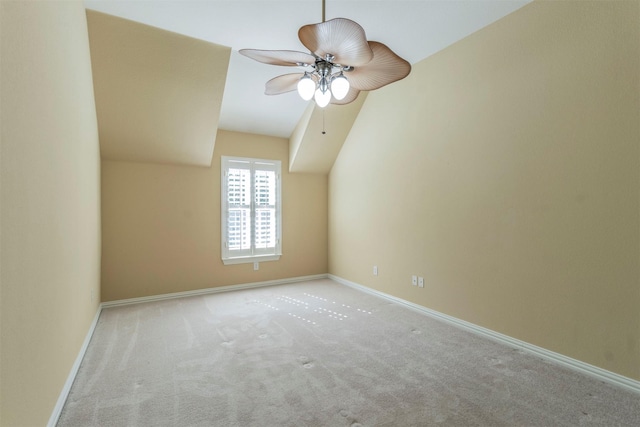 bonus room with light carpet and ceiling fan