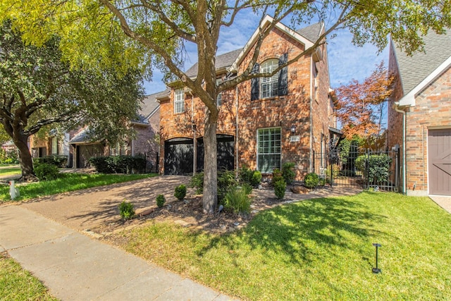 view of front property featuring a garage and a front lawn