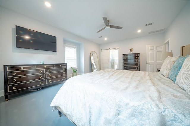 bedroom with a barn door, a ceiling fan, visible vents, and recessed lighting