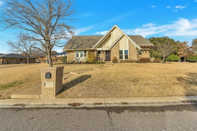 view of front of property with a front lawn