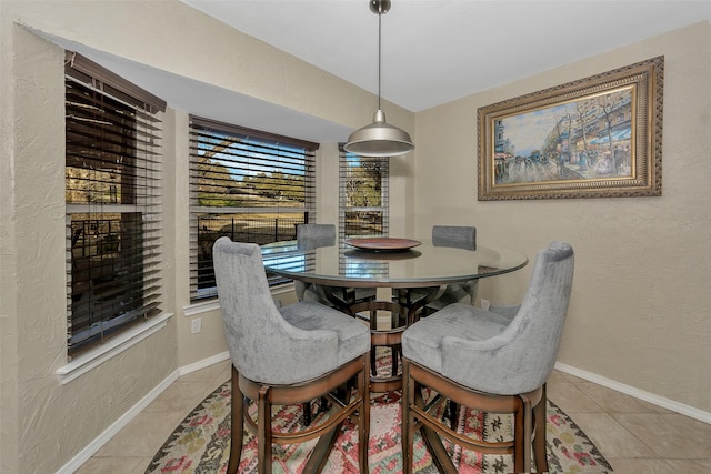 dining area featuring light tile patterned flooring