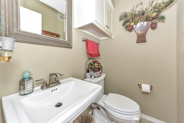 bathroom with sink and toilet