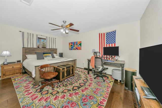 bedroom with ceiling fan and dark hardwood / wood-style floors