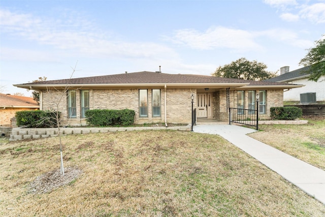 ranch-style house with a front yard