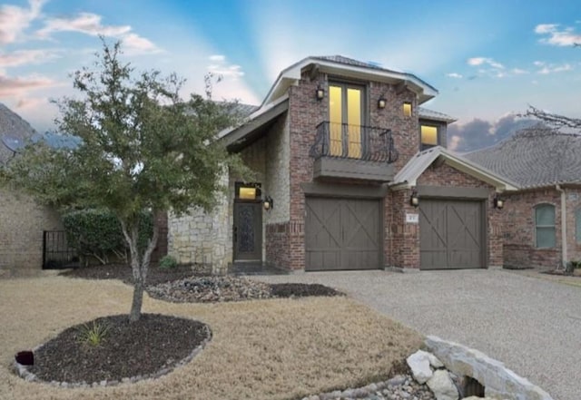 view of front of property with a garage and a balcony