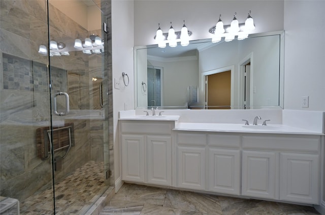 bathroom featuring vanity, crown molding, and a shower with door