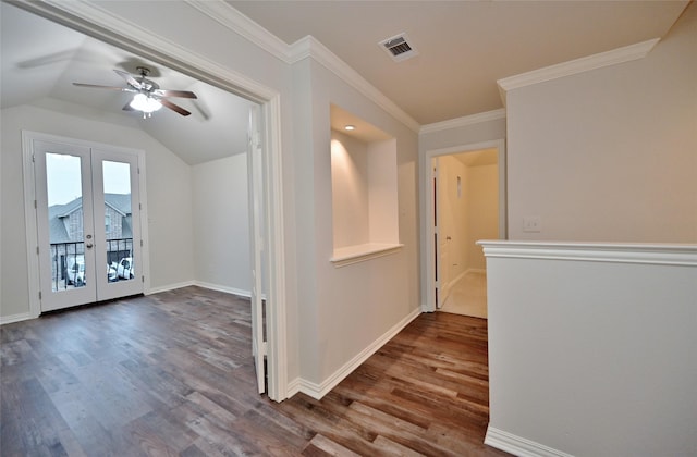 interior space with lofted ceiling, ceiling fan, hardwood / wood-style floors, ornamental molding, and french doors