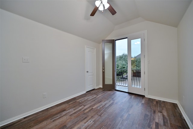 spare room with vaulted ceiling, dark wood-type flooring, and ceiling fan