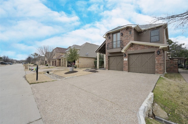 view of front of house featuring a balcony and a garage