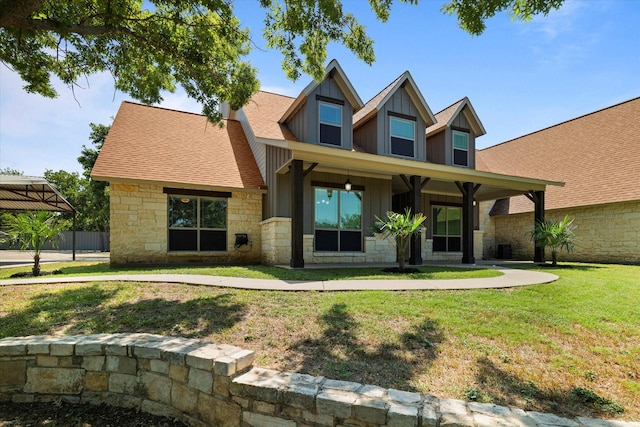 craftsman-style home with a front yard and a porch