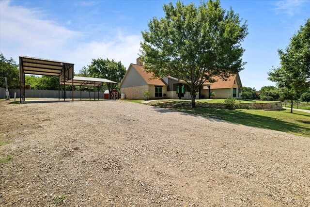 402 N Parkway Dr, Alvarado, TX 76009 - view of front of house featuring a carport and a front lawn