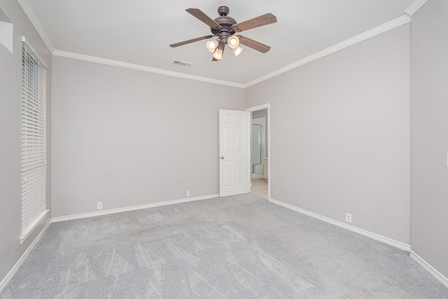 unfurnished bedroom with ceiling fan, ornamental molding, and light carpet