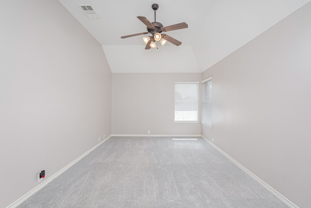 carpeted empty room with lofted ceiling and ceiling fan